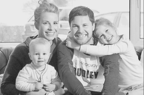 Photo of Dudley and his wife and 2 kids